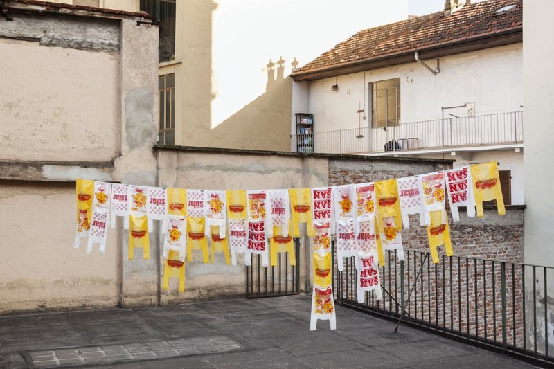 picture of the exhibition location Renata De Bonis Reverence, 2017 Series of plastic bags retrieved from supermarkets and hung on clotheslines at the gallery’s rooftop and neighboring balconies  photo credits: Sebastiano Pellion di Persano