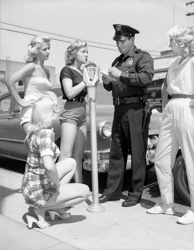 picture of the exhibition location [Four women being ticketed for indecent exposure], Los Angeles, 1946