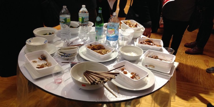 Kwok filled a table with Chinese takeout, telling visitors that if they at the food, they consumed his art.