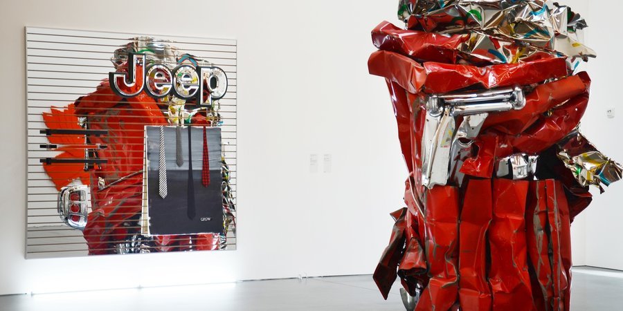 "Crow," 2011, Metal fixtures; car taillight; plastic sign; acrylic and mixed media on canvas on acrylic mirrored MDF slatwall with aluminum edging. (Posing with a John Chamberlain.)