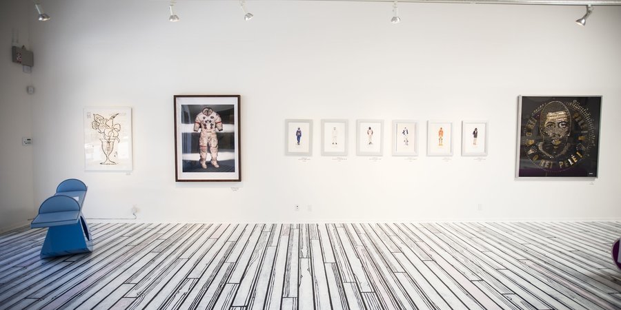 From left to right: 'Flowers,' by Donald Baechler, Albert Watson's Alan Shepard’s 'Lunar Suit, Apollo 14, NASA, 1990.' Far right: 'Pele' by Ann Carington.