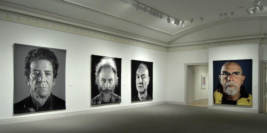 Tapestries, from left: "Lou" (2012), "Lucas" (2011), "Roy" (2013), "Self-Portrait (Yellow Raincoat)" (2013)