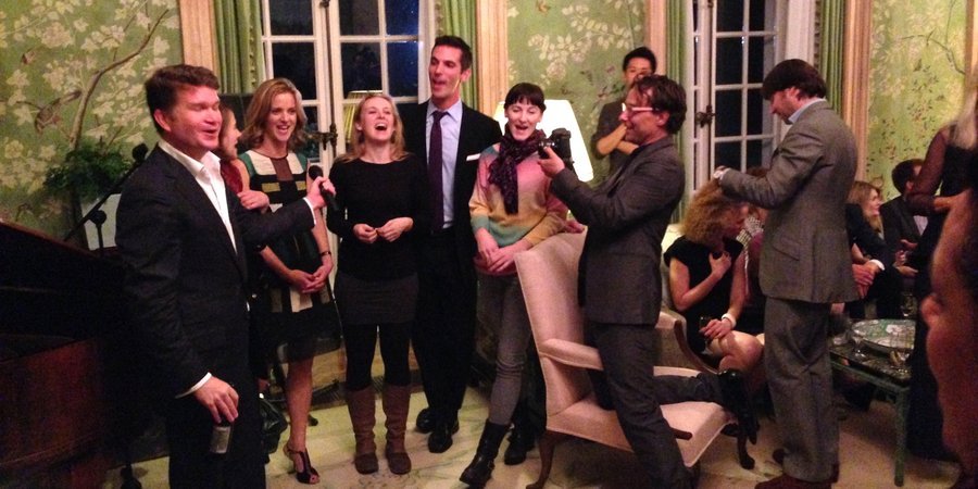 A party at the American ambassador's residence for Jonah Freeman and Justin Lowe, from left: the American ambassador to Britain singing "Edelweiss" with the three granddaughters of Captain Von Trapp