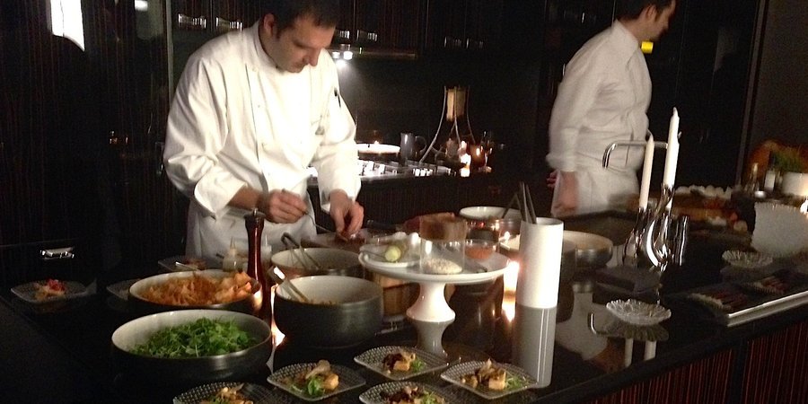 A chef prepares tastings at the Park Hyatt's launch of the new contemporary art magazine ARTPHAIRE