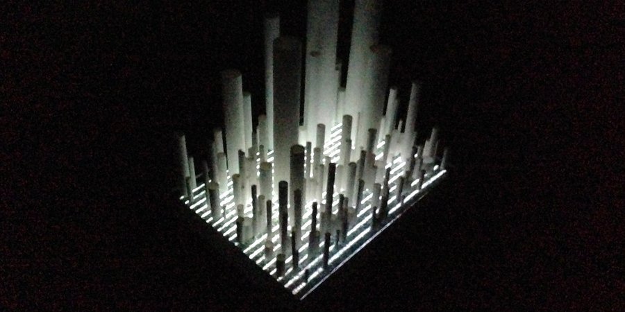 Another piece by Tichy placing paper tubes atop a flat-screen TV