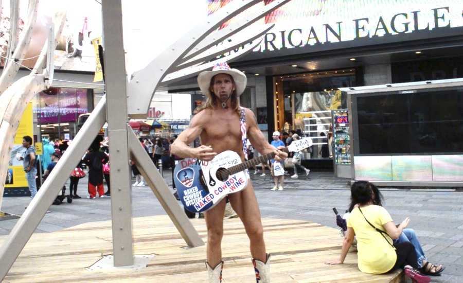 “Buy a Damn Boat Already!”: The Naked Cowboy on Mel Chin’s Times Square Installation About Climate Change