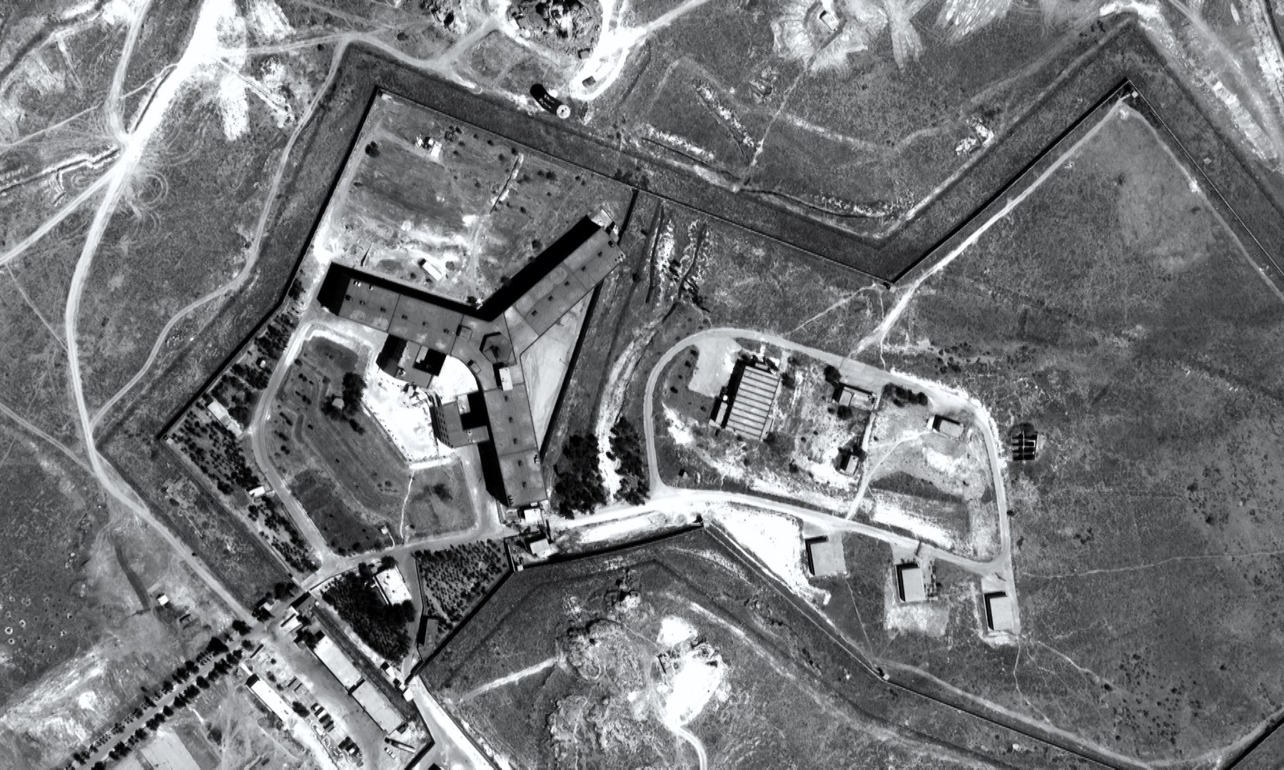 Satellite image of Saydnaya Prison, based on an Amnesty reconstruction. Image via the arti