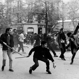 Bruno Barbey, France. Paris. 6th arrondissement. Boulevard Saint Germain. May 6th 1968. Students hurling projectiles against the police.