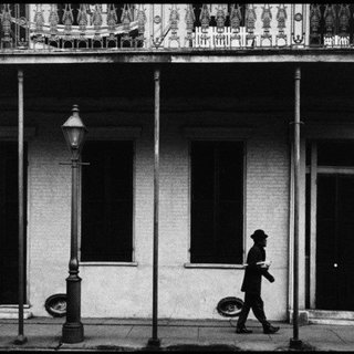 Dennis Stock, USA. New Orleans, Louisiana. 1958. Ernest Miller nicknamed Kid Punch Miller trumpet player and singer returning home at 6 am.