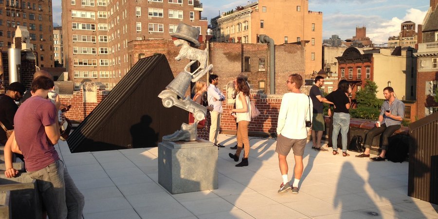 Jay Batlle's stacked steel Monopoly figurines on the roofdeck of the Bleecker Street Arts Club.