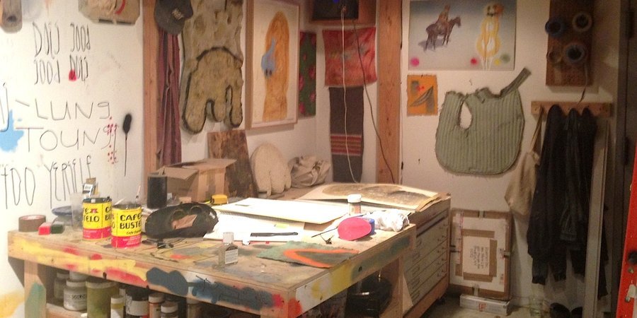 Doodles, fabric, and drawings on the walls of Kevin Lips's studio.