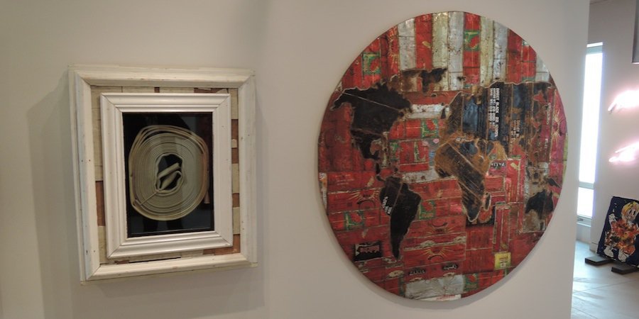 From left, a Theaster Gates piece titled <em>Break Glass in Case of Race Riot</em>, referencing the history of dispersing black protests with a fire hose, and an Adel Abdessamed piece 