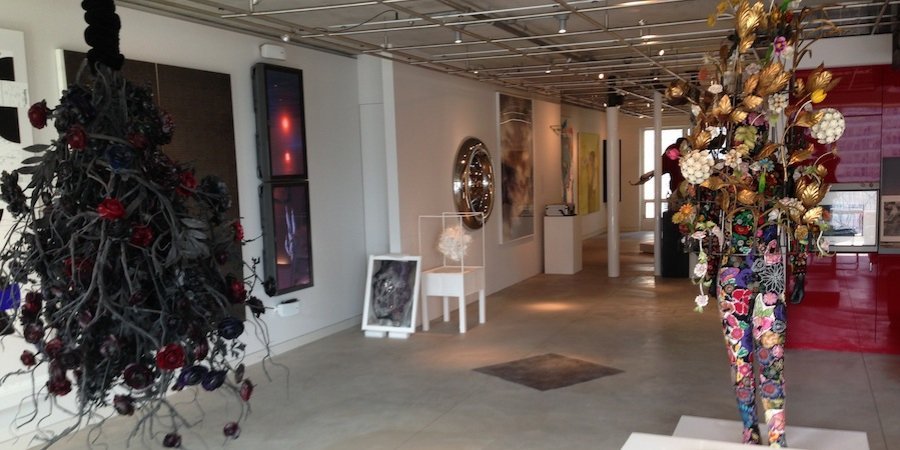 A view of the gallery space, with a Nick Cave commanding the center of the room