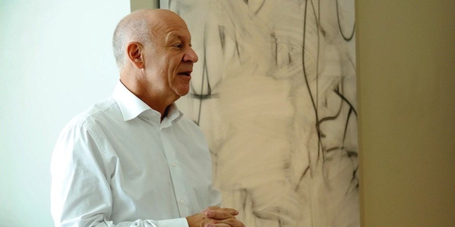 Larry Fields at home with a Christopher Wool