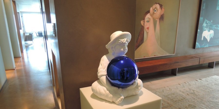 Upon entering the apartment, one is greeted by a "gazing ball" piece by Jeff Koons—acquired from the artist's recent show at David Zwirner—that Larry says is both an evocation of childhood innocence and a reference to the orb-like lawn ornaments common in the suburban neighborhood where Koons grew up.