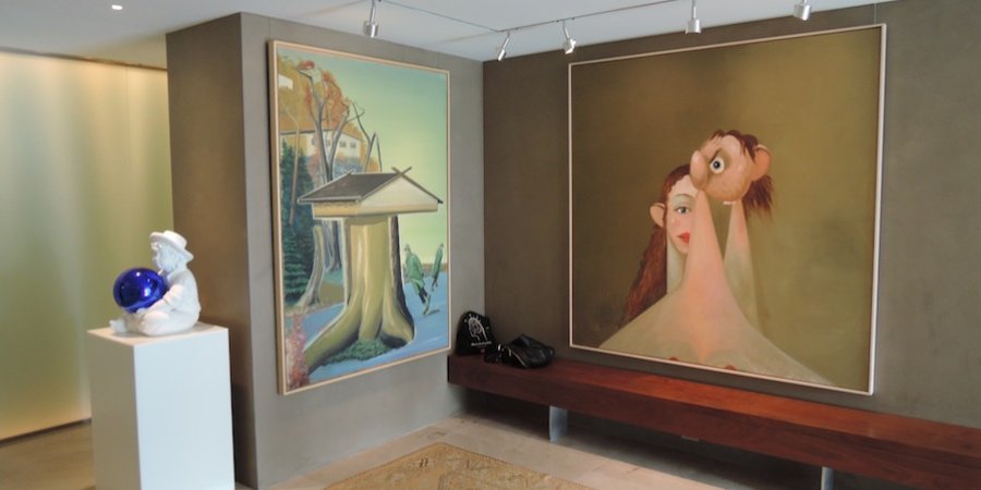 Behind the Koons is a Neo Rauch, which Larry describes as a surreal yet classically composed commentary on life in East Germany under the Stasi, and a George Condo.