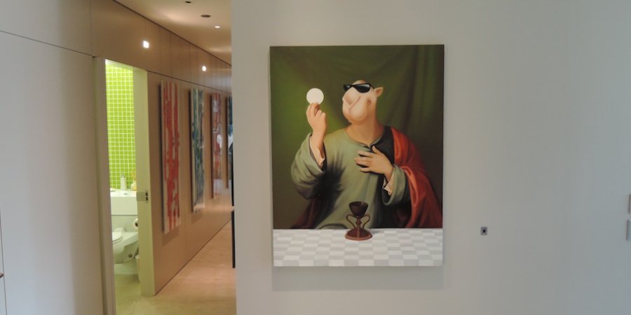A painting by the Chinese artist Zhou Tiehai reimagining Joe Camel as Christ fills a wall by the kids' rooms