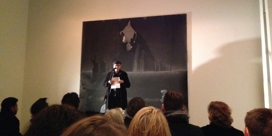 Jonas Mekas reading a poem at the Hole