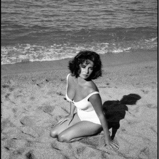 Burt Glinn, Spain. Sagaro. 1959. Twenty-five-year-old Elizabeth Taylor on the set of "Suddenly Last Summer", in which she co-stars with Katharine Hepburn and Montgomery Clift. It is Taylor's first film after the death of her 3rd husband, Mike Todd, in a plane crash. 